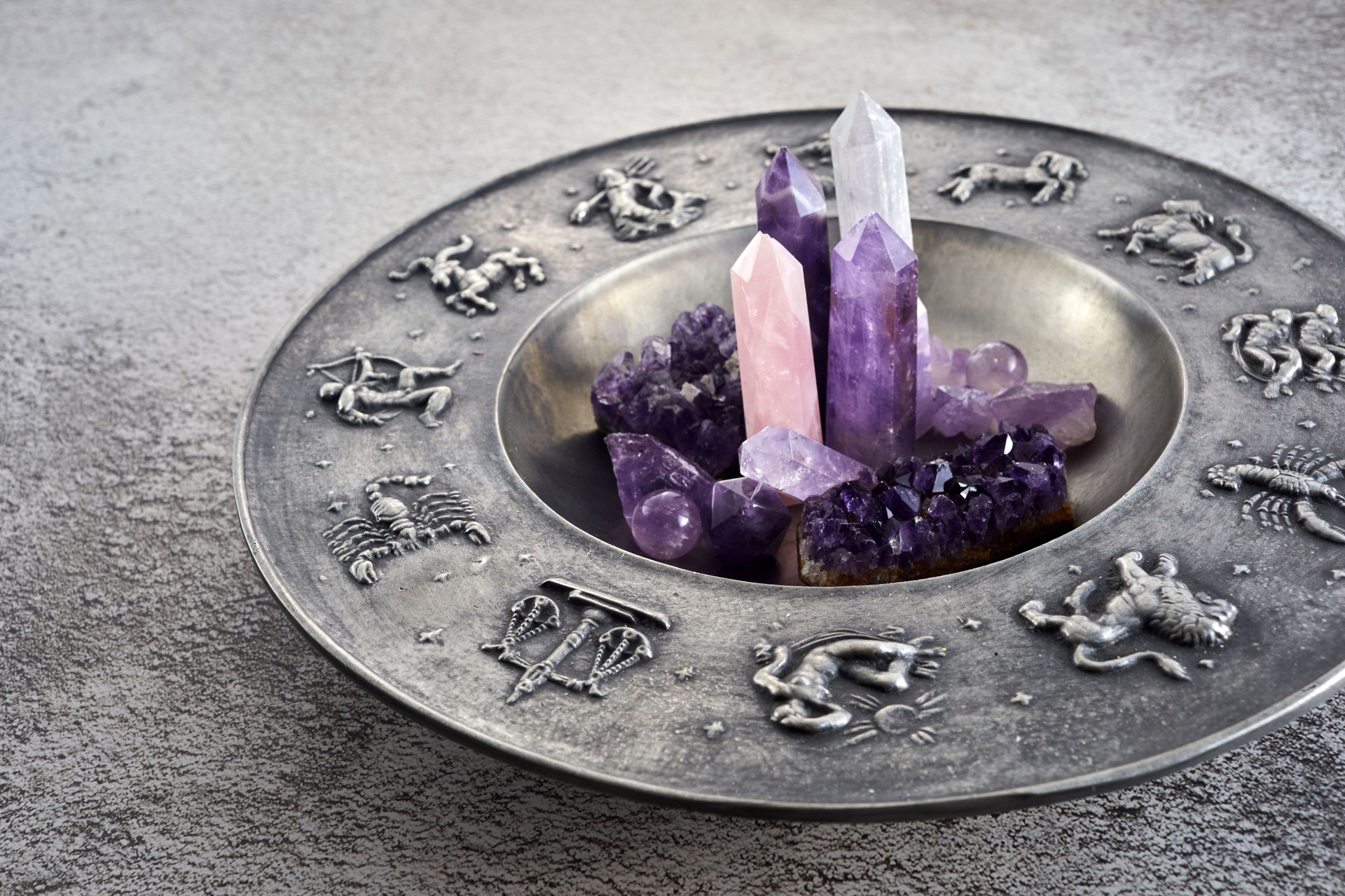 Crystals for healing, fortune telling and astrologhy circle on grey background. Esoteric and life coaching concept.